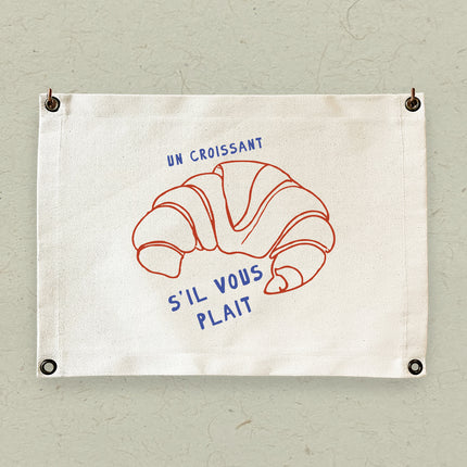 Un Croissant - Canvas & Grommet Wall Hanging